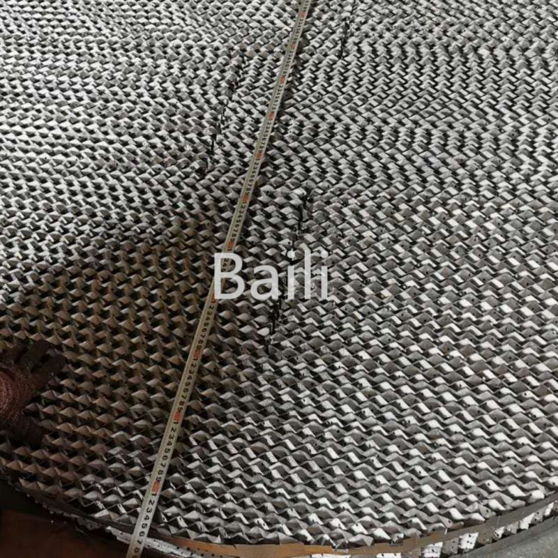Corrugated packing of metal calendered perforated sheet